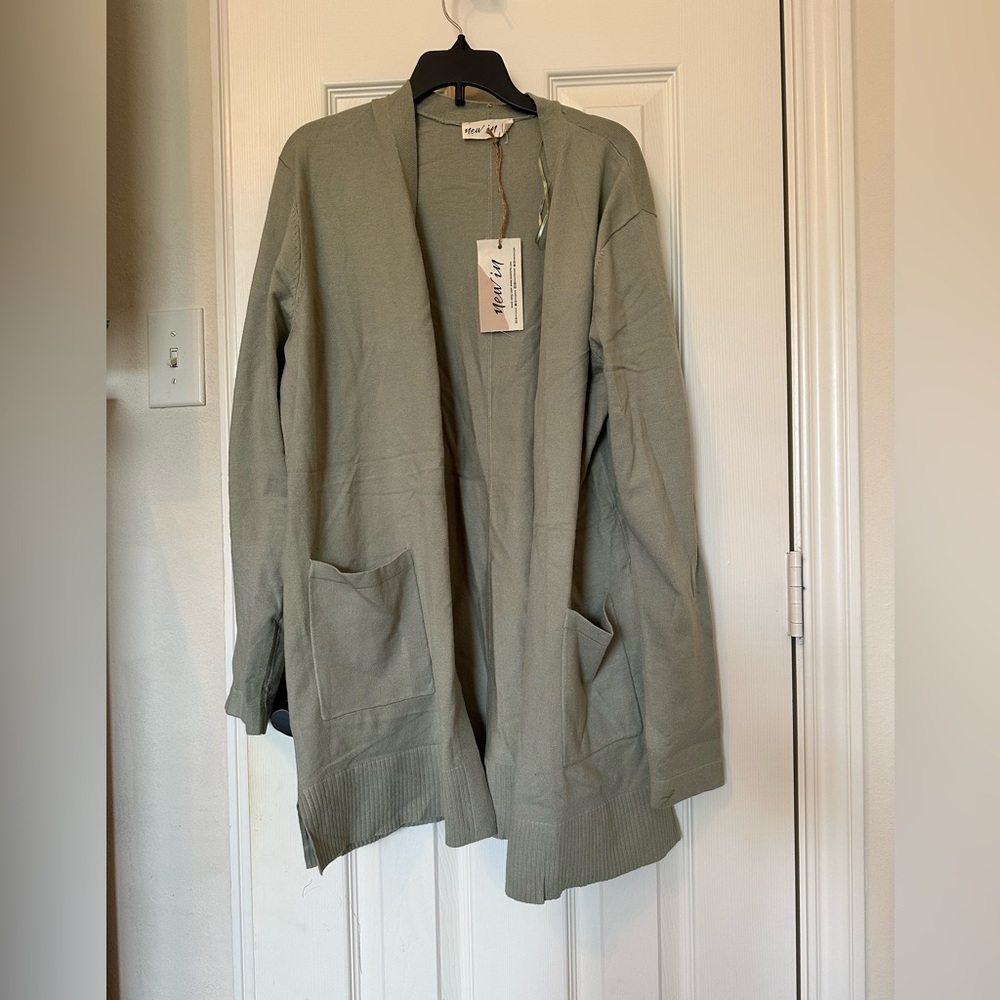 New In size small cardigan
